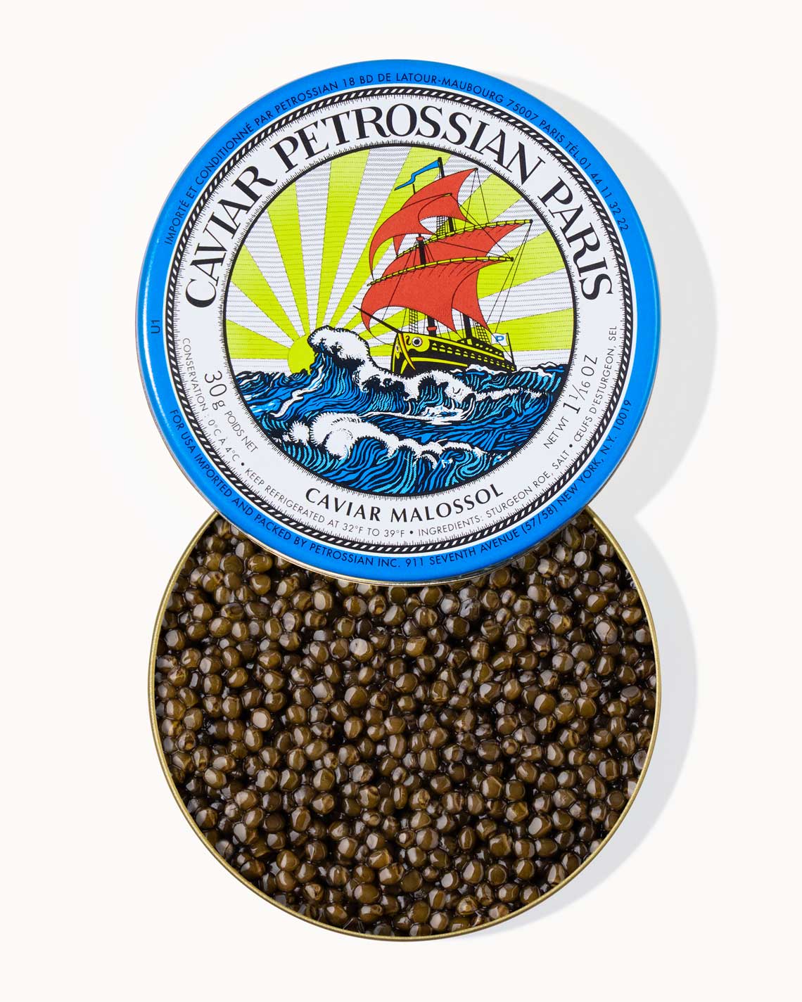 A top down image of an opened blue tin of Petrossian caviar, sitting on a white background. The tin is filled with plump, glistening dark green beads of Alverta caviar.