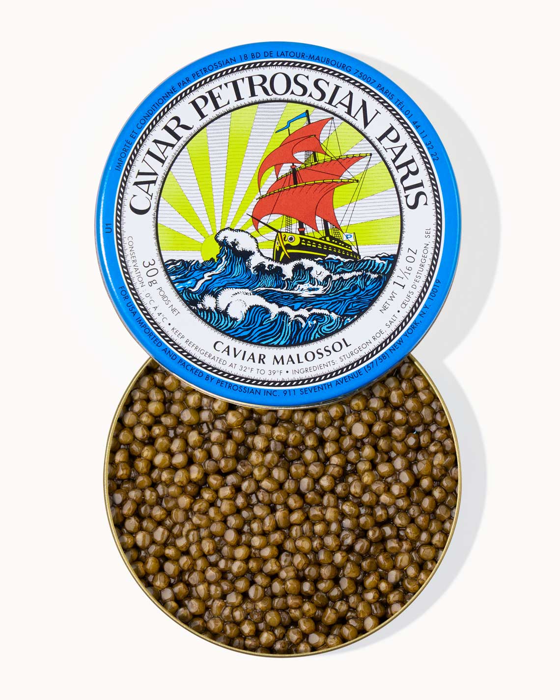 A top down image of an opened blue tin of Petrossian caviar, sitting on a white background. The tin is filled with plump, glistening bright amber beads of Ossetra caviar.
