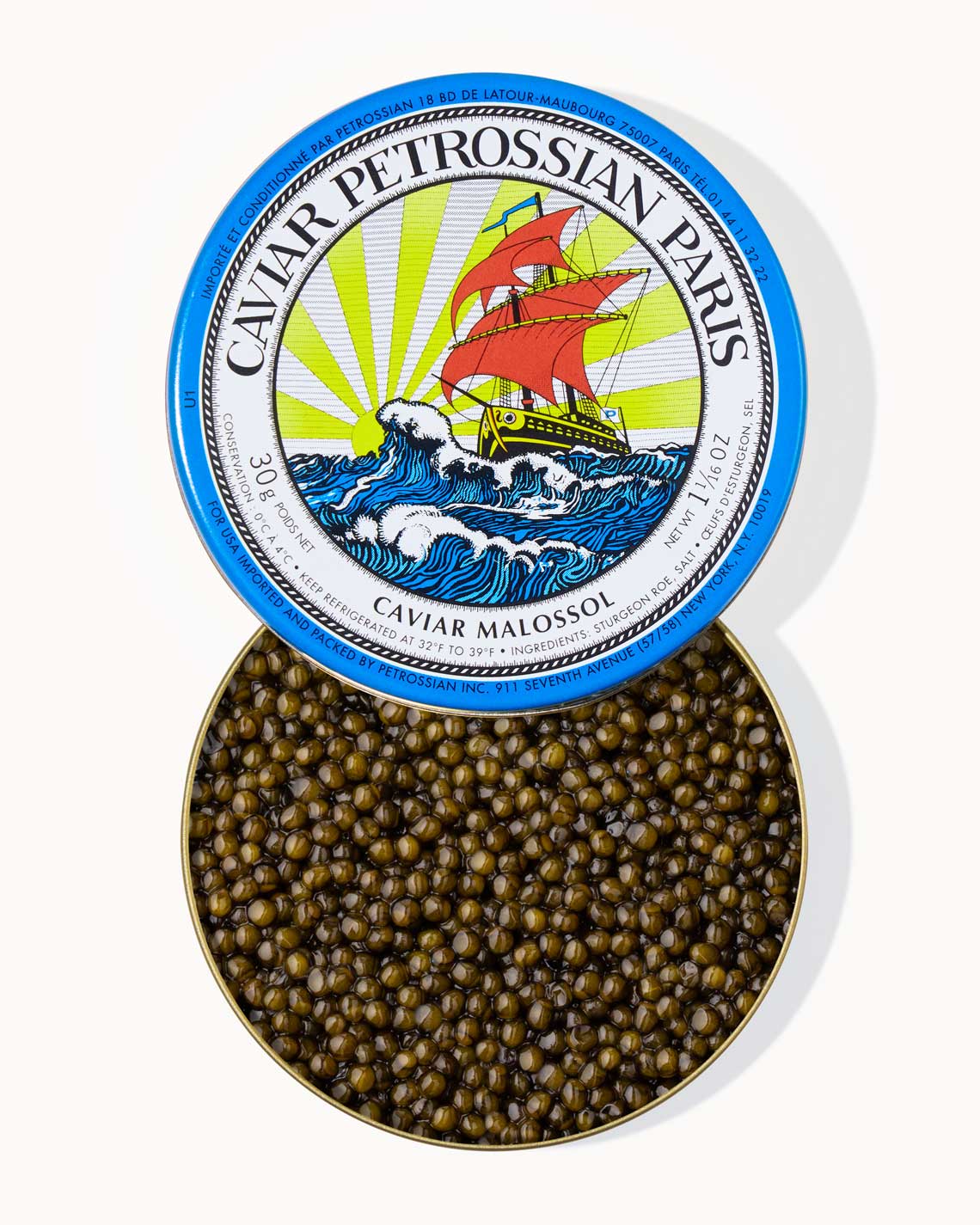 A top down image of an opened blue tin of Petrossian caviar, sitting on a white background. The tin is filled with plump, glistening vibrant green beads of Kaluga caviar.