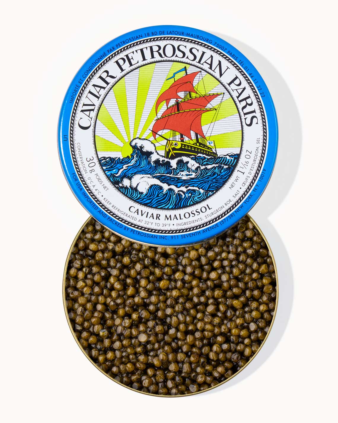 A top down image of an opened blue tin of Petrossian caviar, sitting on a white background. The tin is filled with plump, glistening bright green vibrant beads of Kaluga caviar.