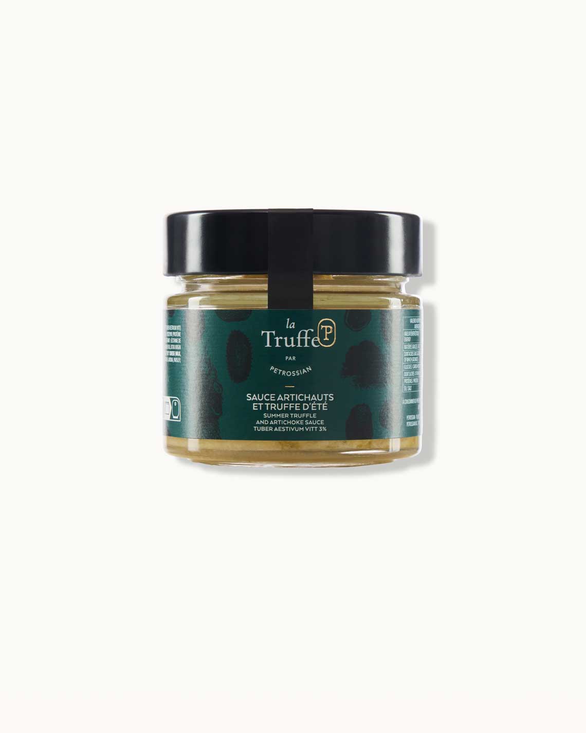 a short glass jar with a black lid and dark green "la truffe" label, filled with dark yellow-green truffled artichoke sauce