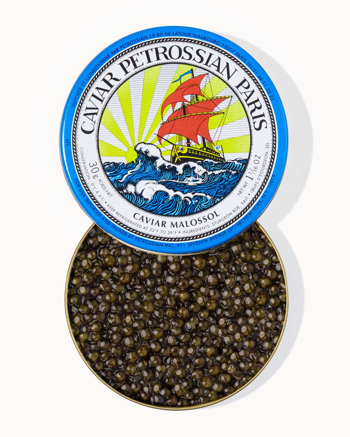 A top down image of an opened blue tin of Petrossian caviar, sitting on a white background. The tin is filled with plump, glistening bright green beads of Alverta caviar.