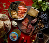 a gourmet tasting board from Petrossian with artisanal cured meats, caviar, and smoked sea